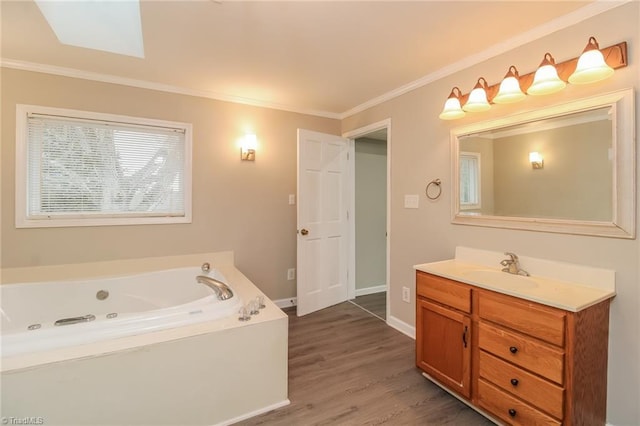 323 Anderson Rd, Eden, NC 27288 - full bathroom featuring baseboards, a whirlpool tub, ornamental molding, wood finished floors, and vanity
