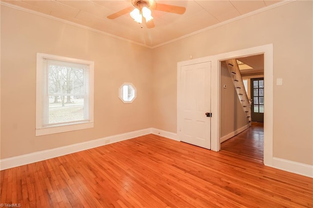 323 Anderson Rd, Eden, NC 27288 - spare room with a ceiling fan, light wood-style floors, baseboards, and ornamental molding