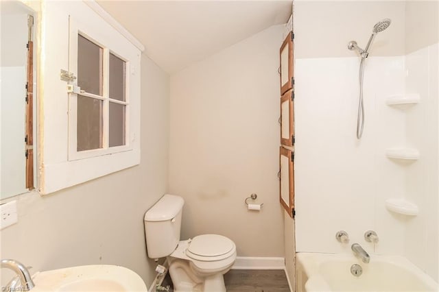 323 Anderson Rd, Eden, NC 27288 - bathroom with toilet, a sink, shower / washtub combination, wood finished floors, and baseboards