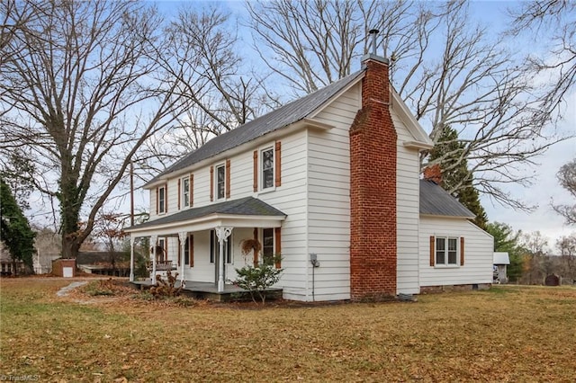 323 Anderson Rd, Eden, NC 27288 - view of home's exterior with a yard, a porch, and a chimney