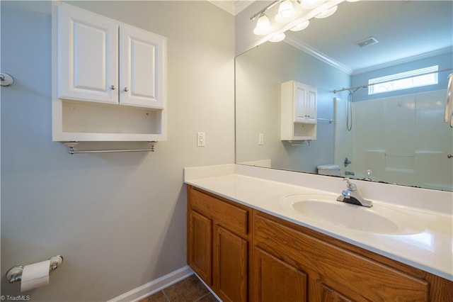 full bath with visible vents, a shower, ornamental molding, tile patterned floors, and vanity