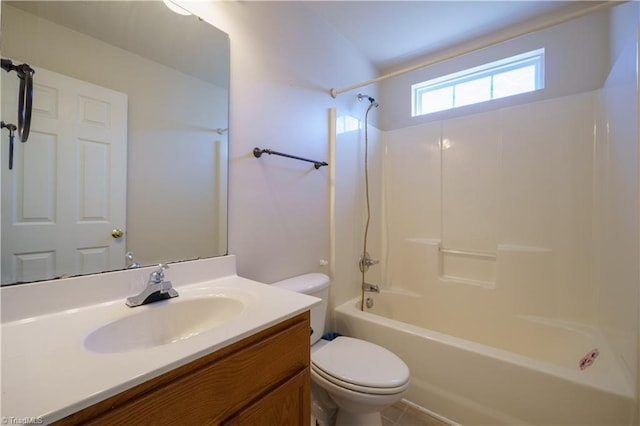 full bathroom with bathtub / shower combination, vanity, and toilet