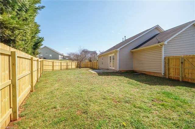 view of yard with a fenced backyard