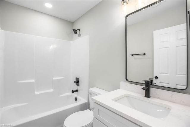 full bathroom featuring vanity, shower / bath combination, and toilet