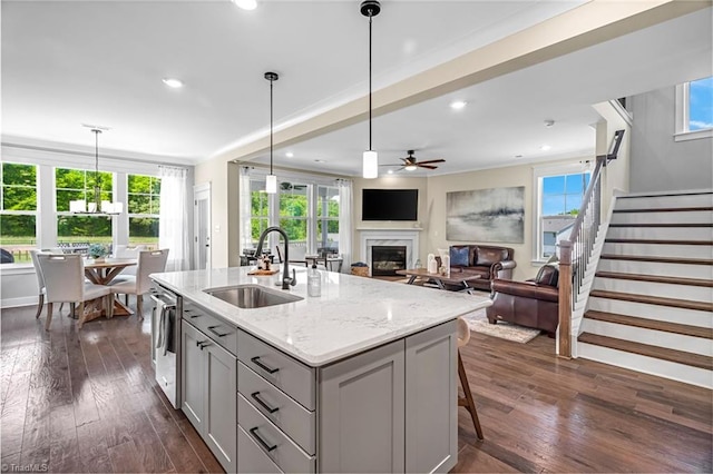 7733 Michaelis St, Greensboro, NC 27455 - kitchen featuring a sink, gray cabinetry, stainless steel dishwasher, dark wood-style floors, and ceiling fan