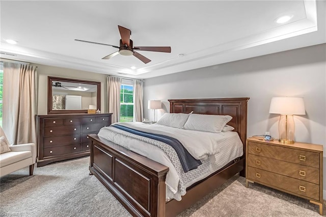 7733 Michaelis St, Greensboro, NC 27455 - bedroom featuring light carpet, recessed lighting, a tray ceiling, and ceiling fan