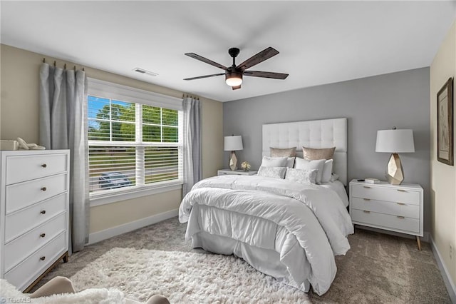 7733 Michaelis St, Greensboro, NC 27455 - carpeted bedroom with baseboards and a ceiling fan