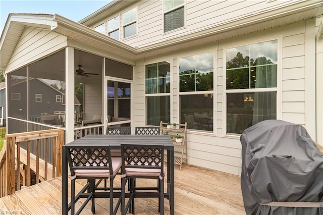 7733 Michaelis St, Greensboro, NC 27455 - wooden terrace with a sunroom, outdoor dining space, a ceiling fan, and area for grilling