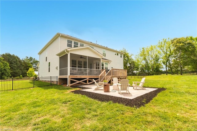 7733 Michaelis St, Greensboro, NC 27455 - back of property featuring ceiling fan, a patio area, a sunroom, and a fire pit