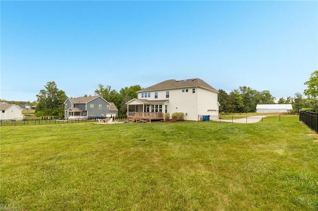 7733 Michaelis St, Greensboro, NC 27455 - back of property with a wooden deck and a sunroom