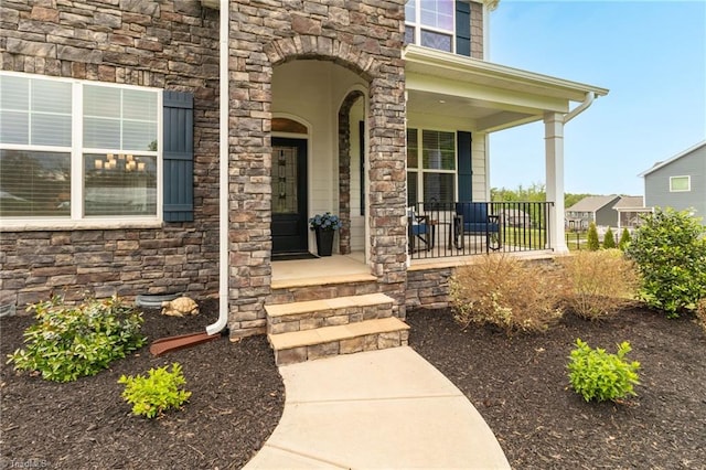 7733 Michaelis St, Greensboro, NC 27455 - property entrance with stone siding and a porch