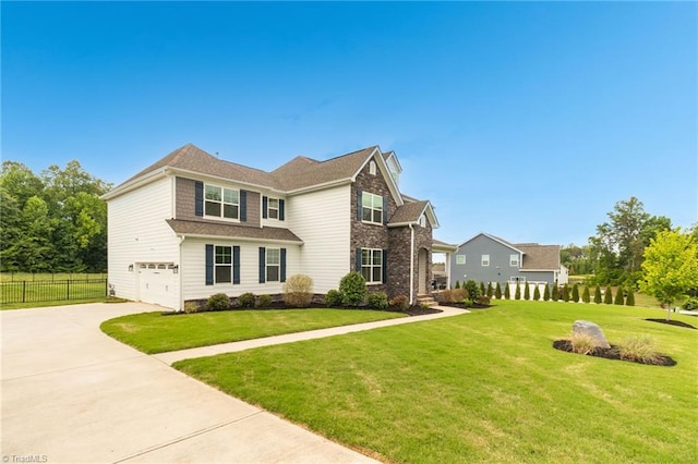 7733 Michaelis St, Greensboro, NC 27455 - view of front of home with an attached garage and concrete driveway