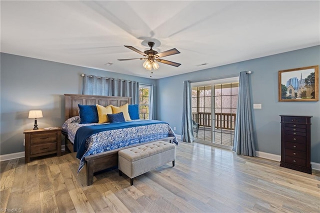 bedroom with access to outside, wood finished floors, a ceiling fan, and baseboards