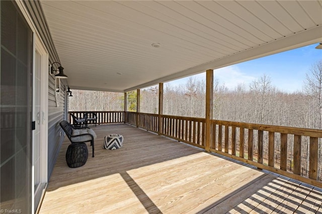 deck featuring a forest view