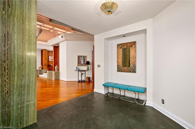 corridor with beam ceiling and dark hardwood / wood-style flooring