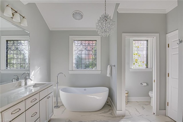 bathroom featuring vanity, a tub, toilet, ornamental molding, and a notable chandelier