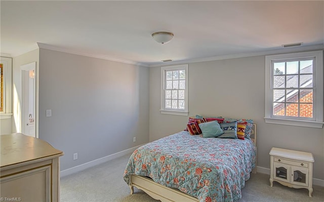 carpeted bedroom with ornamental molding