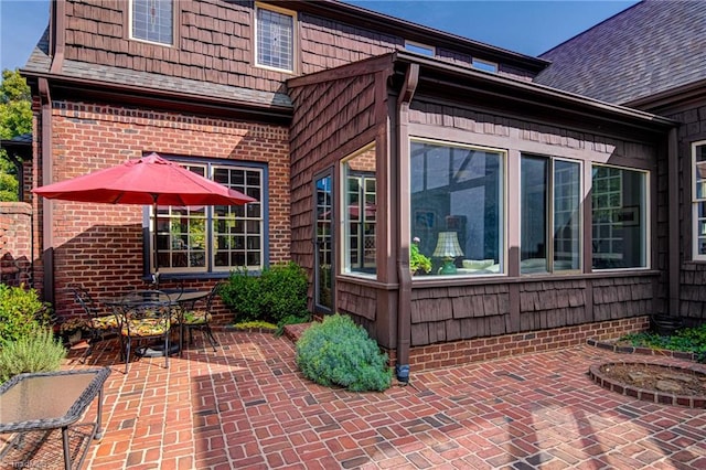 view of side of property with a patio