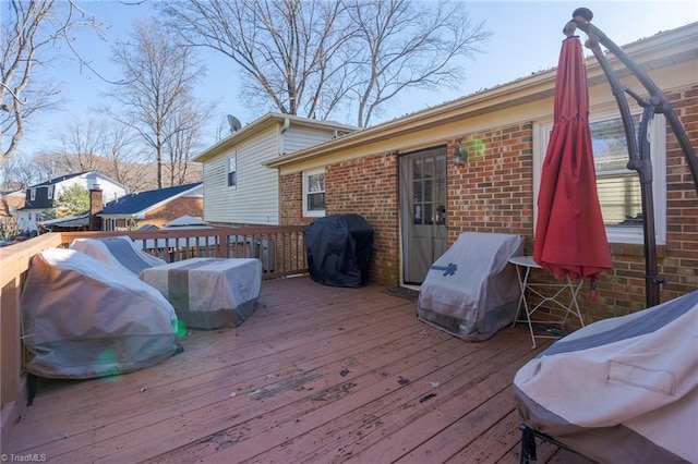 wooden terrace with grilling area