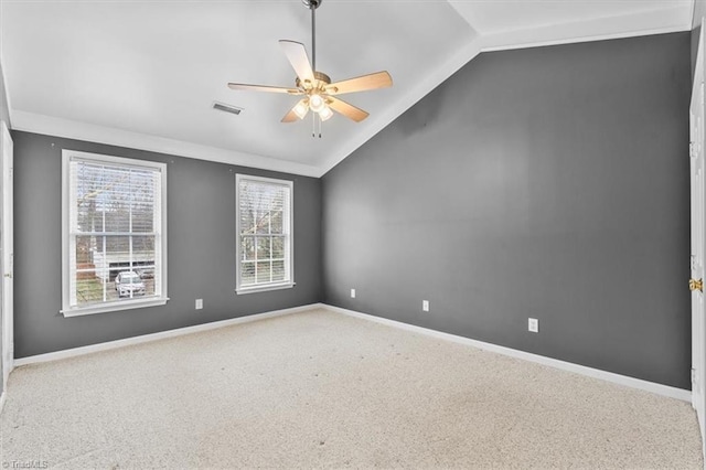 unfurnished room featuring ceiling fan, vaulted ceiling, and carpet flooring