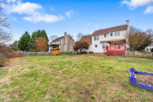 view of yard with a wooden deck