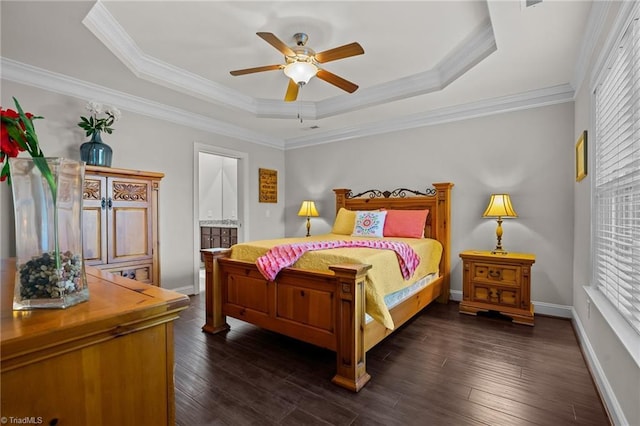 bedroom featuring dark hardwood / wood-style flooring, ensuite bathroom, multiple windows, and crown molding