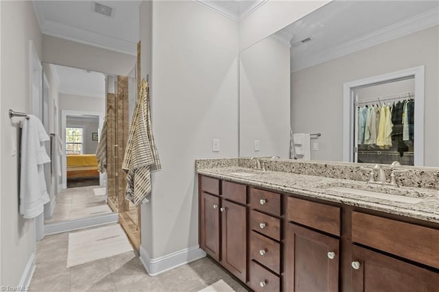 bathroom with tile patterned flooring, vanity, and ornamental molding