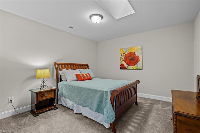 carpeted bedroom with a skylight