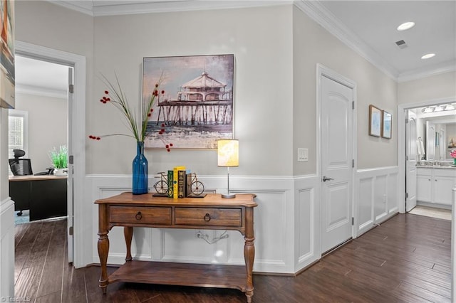 corridor with crown molding and dark wood-type flooring