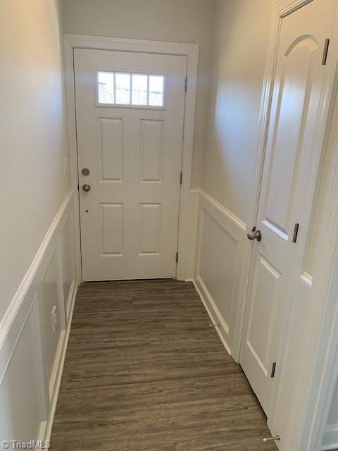 doorway featuring dark hardwood / wood-style floors