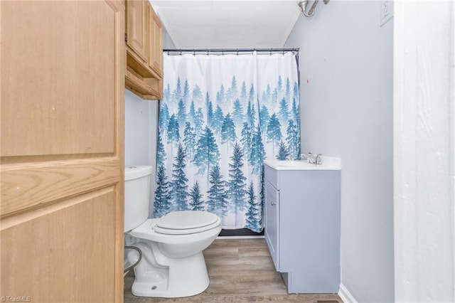 1414 E 3rd St, Winston-Salem, NC 27101 - full bath featuring vanity, wood finished floors, and a shower with shower curtain