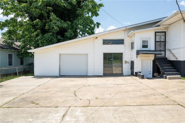 1414 E 3rd St, Winston-Salem, NC 27101 - view of front of property featuring concrete driveway, stairway, and a garage