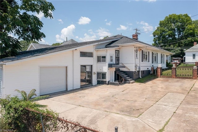 1414 E 3rd St, Winston-Salem, NC 27101 - view of front of house with concrete driveway, a gate, and a garage