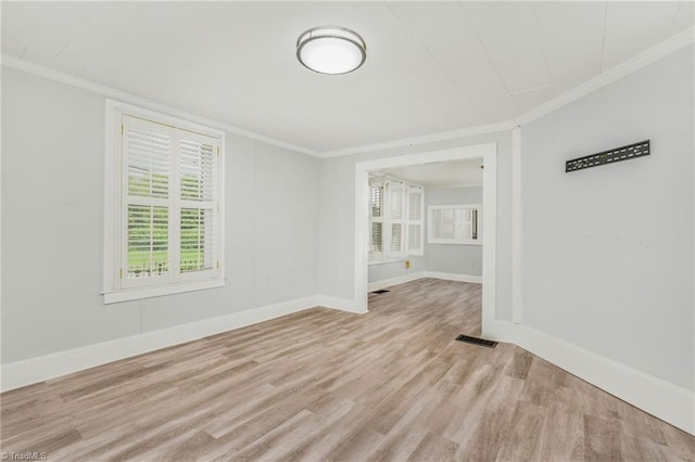 1414 E 3rd St, Winston-Salem, NC 27101 - spare room with light wood finished floors and ornamental molding