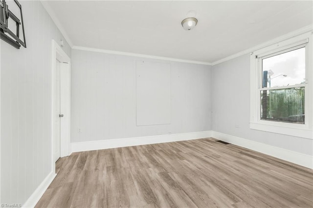 1414 E 3rd St, Winston-Salem, NC 27101 - empty room featuring wood finished floors and ornamental molding