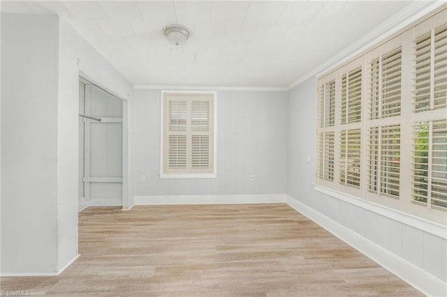 1414 E 3rd St, Winston-Salem, NC 27101 - unfurnished bedroom featuring wood finished floors and ornamental molding