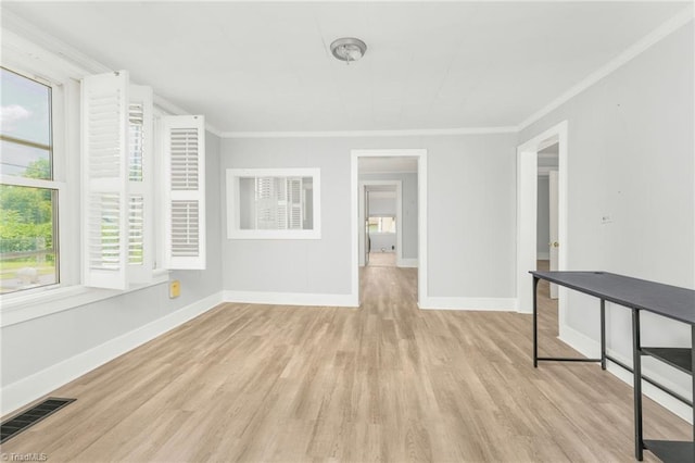 1414 E 3rd St, Winston-Salem, NC 27101 - spare room featuring wood finished floors and crown molding