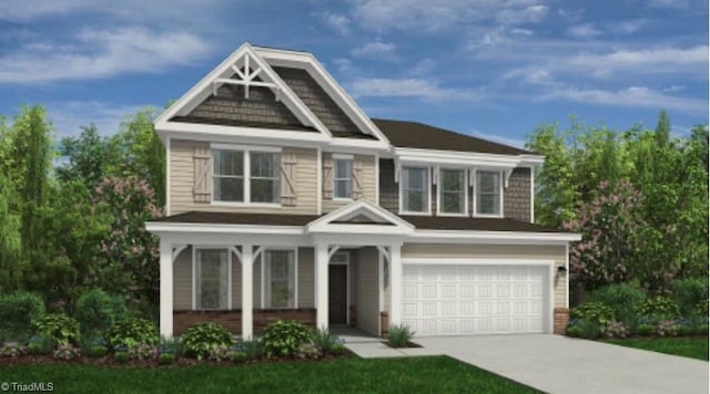 view of front of home featuring an attached garage and concrete driveway