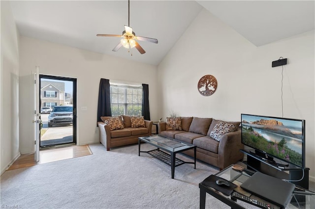 living room with ceiling fan, light carpet, and high vaulted ceiling