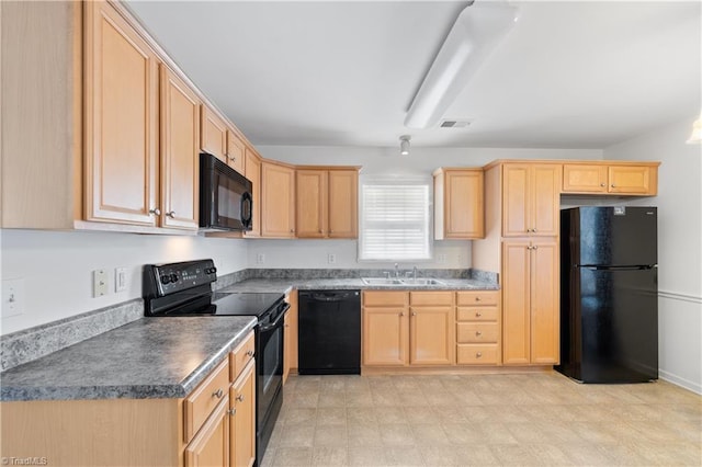 kitchen with light brown cabinets, sink, and black appliances