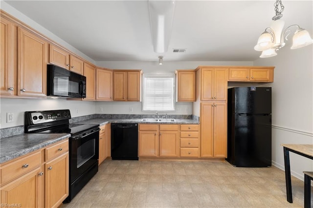 kitchen with black appliances, pendant lighting, sink, and an inviting chandelier