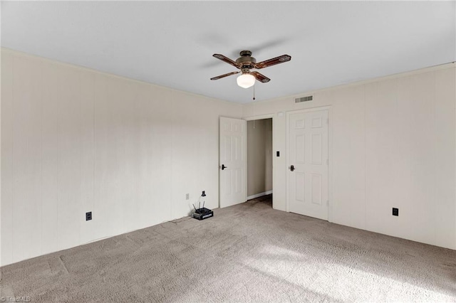 empty room with carpet and ceiling fan