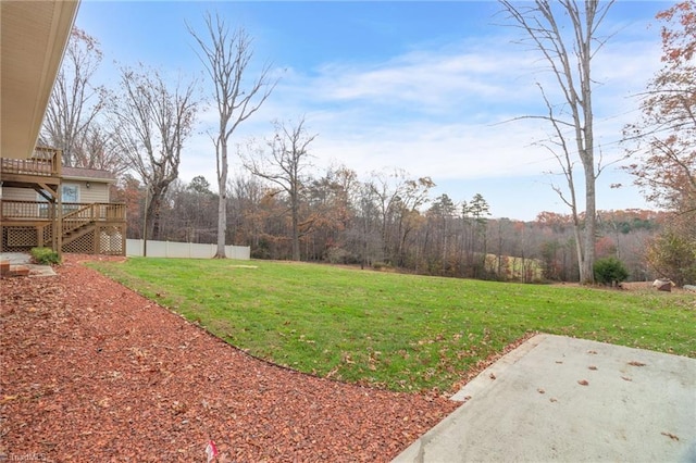 view of yard featuring a patio area and a deck