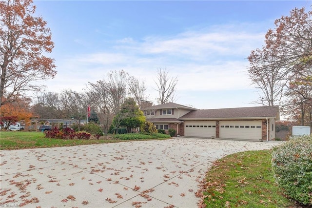 front of property with a front lawn and a garage