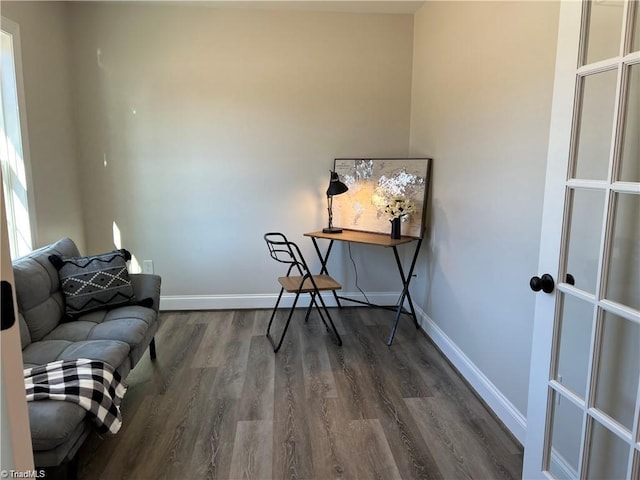 sitting room with dark hardwood / wood-style floors and french doors