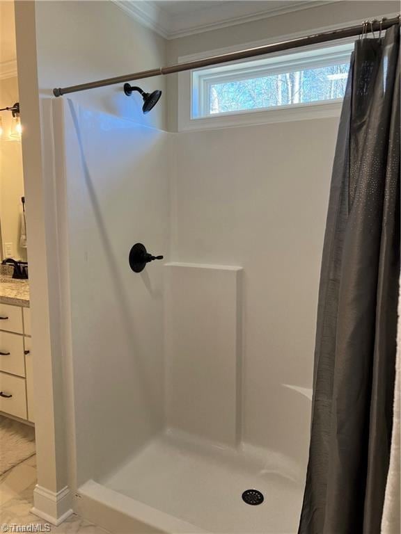 bathroom with tile floors, curtained shower, crown molding, and vanity