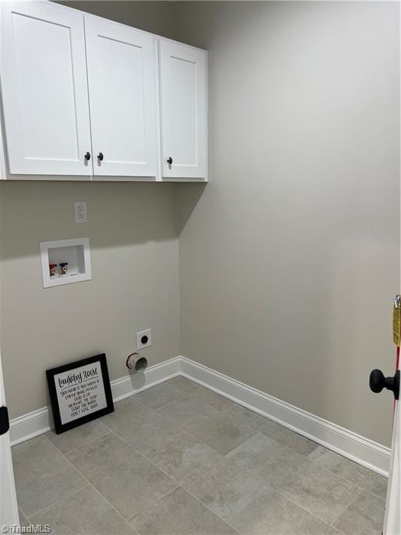 laundry room with washer hookup, cabinets, electric dryer hookup, and light tile floors