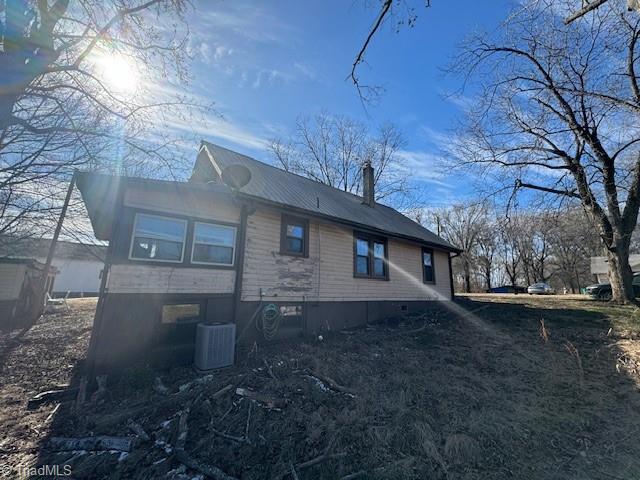 view of home's exterior with central AC