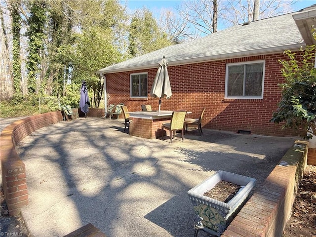 view of patio / terrace featuring a fire pit