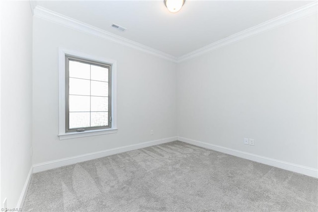 spare room with crown molding and light carpet